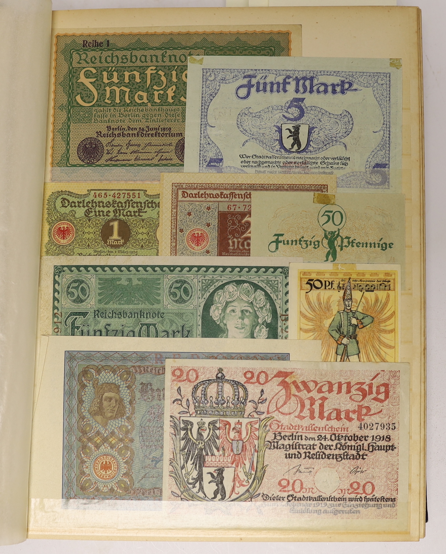 A large collection of German States and City banknotes, 1914-24, and Reichsbank notes from 1904-1948, the majority in near mint condition and a German East Africa one rupee banknote 1 November 1915, in two albums